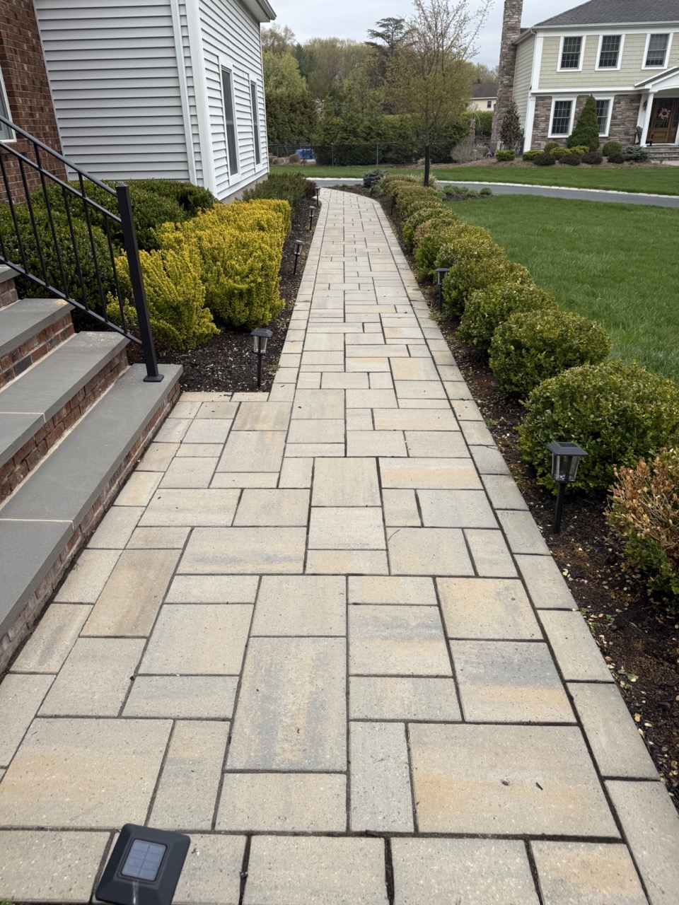 Bluestone front entry walkway with Belgian block border and perennial plantings